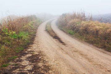 Fototapeta na wymiar Dirt road in mist