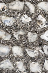 Shale and pebble wall closeup.