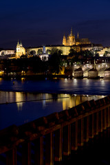 Fototapeta na wymiar Night colorful Prague gothic Castle above the River Vltava with Charles Bridge, Czech Republic