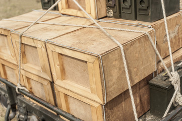 A stack of wooden crates full of ammo
