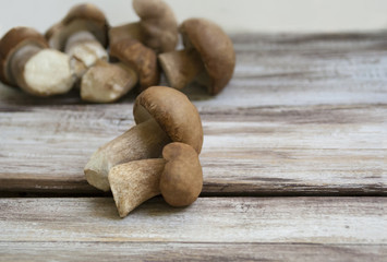 mushrooms lie on a wooden background, autumn, cooking recipe