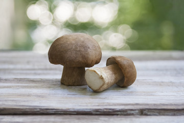 mushrooms lie on a wooden background, autumn, cooking recipe