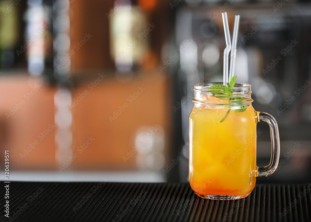 Poster cocktail in glass jar on bar counter