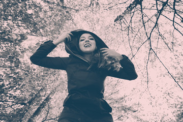 Lady dancing in forest.