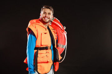 Lifeguard in life vest with ring buoy lifebuoy.