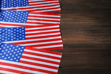 American flags on wooden background