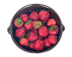 Fresh organic strawberries in berry bowl separated on white background