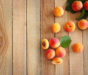 Fresh apricots on wooden table