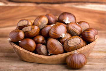 pile of chestnuts in a wooden bowl