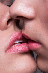 Close-up two lips kissing sensual intimate