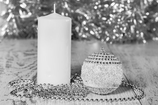 Christmas ball, candle and beads, black-and-white