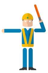 誘導灯を持つ男性
