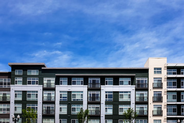 Modern apartment buildings on a sunny day with a blue sky