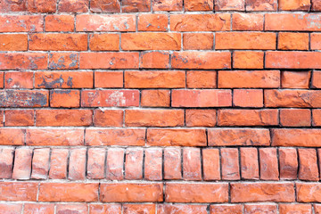 Brick wall of the old red brick. The texture of a brick wall. The horizontal masonry. Texture as background with a copy of the space.