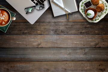 Scone and office stuff on wood.