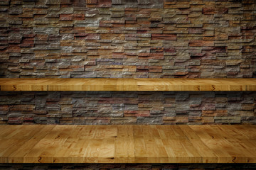 Empty top wooden shelf in front of a sand stone wall.background. For montage product display