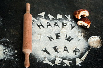 New year 2017 inscription of flour on the table
