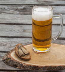 Glass of beer  on a wooden table