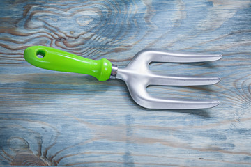 Trowel fork on wooden board horizontal view gardening concept