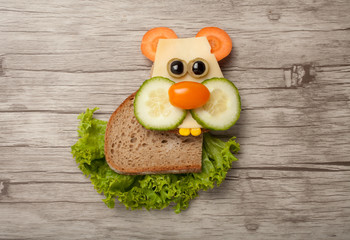 Hamster made of bread and vegetables on desk © serg78
