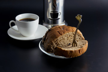  fresh black coffee with chocolate chip sliced bread on the back