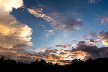 colorful of sunset clouds sky background in the evening with silhouette nature