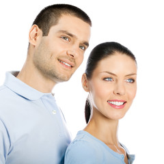 Young smiling couple looking up, isolated
