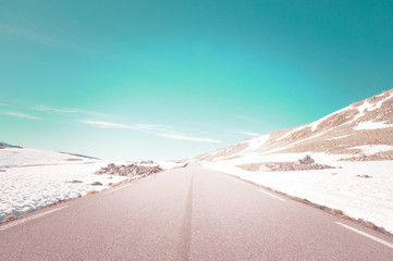 snowy road in winter mountains of norway, tindevegen