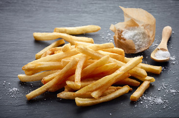 french fries on black stone background