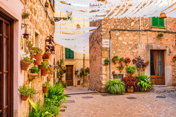 Beautiful street with flowers in the old village Valldemossa Majorca Spain
