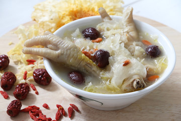 Traditional chinese chicken soup with snow fungus, red dates and goji