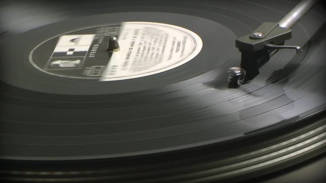 Turntable profile of black 33 rpm record playing on a vinyl record player