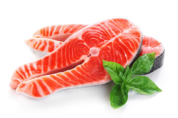 Fresh salmon with basil isolated on white background