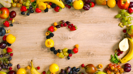 Fruits made letter C. Fruits are forming letters. The composition of bright ripe fruits. The composition of bright ripe fruits. C