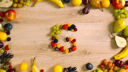 Fruits made letter G. Fruits are forming letters. Alphabet made of fruits. G