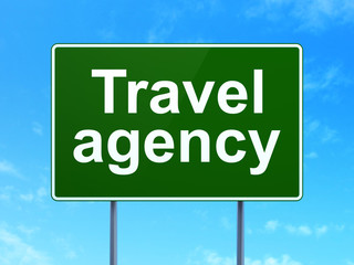 Tourism concept: Travel Agency on road sign background