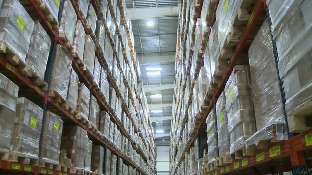 Warehouse. View on lot of shelves with boxes