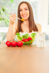 Woman is eating salad