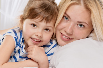 Mother and daughter closed portrait