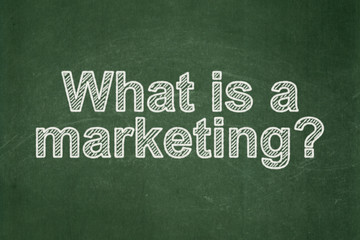 Obraz premium Advertising concept: What is a Marketing? on chalkboard background