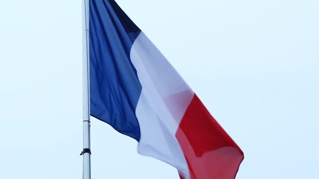 France flag on a flagpole blowing in the wind