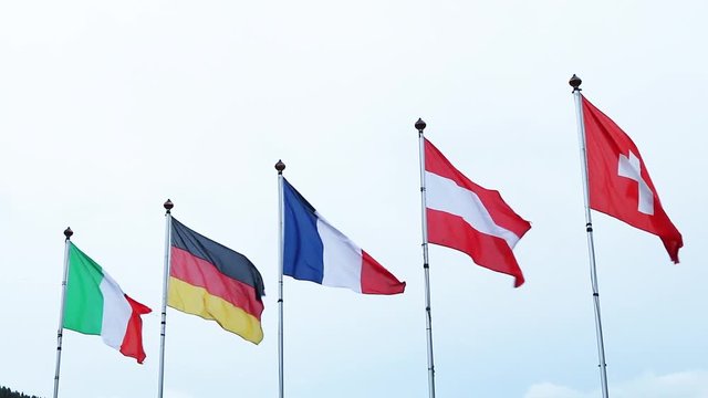 Flags of the world on a flagpole blowing in the wind