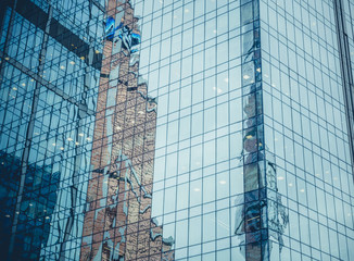 Modern facade of glass and steel reflecting sky