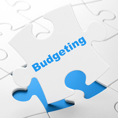 Finance concept: Budgeting on puzzle background