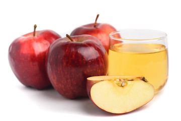 Red apple and juice on white background