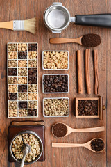 Coffee beans with coffee grinder and ground coffee in wooden spoon 
