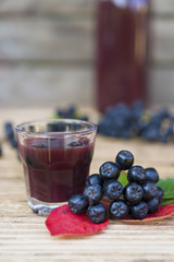 A glass of tincture of chokeberry.