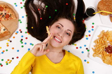 Girl eat fastfood. Unhealthy concept