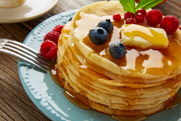 pancakes breakfast syrup coffe and orange juice