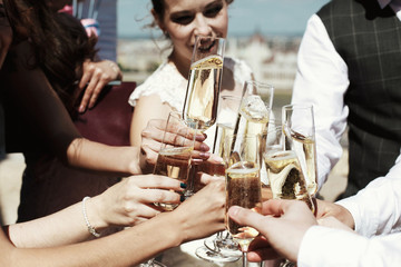 clink glasses of champagne